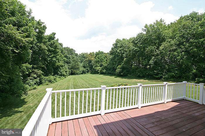 4830 Roop Road Mount Airy, MD 21771 - Photo 25 of 30 a view of balcony with wooden floor and fence