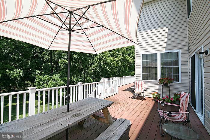 4830 Roop Road Mount Airy, MD 21771 - Photo 26 of 30 a view of balcony with wooden floor and outdoor seating