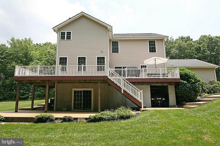 4830 Roop Road Mount Airy, MD 21771 - Photo 27 of 30 a front view of a house with a yard and porch