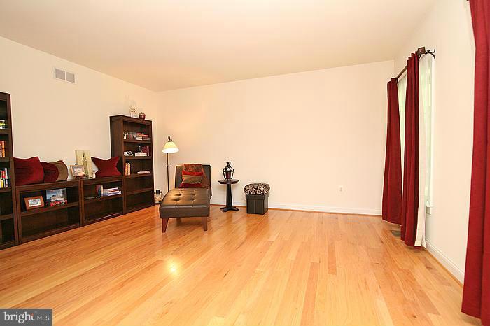 4830 Roop Road Mount Airy, MD 21771 - Photo 7 of 30 a living room with furniture and a flat screen tv