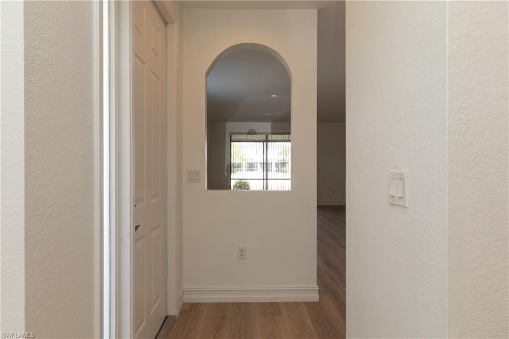 15618 Summit Pl Circle, Unit 396 Naples, FL 34119 - Photo 12 of 41 a view of front door with a door