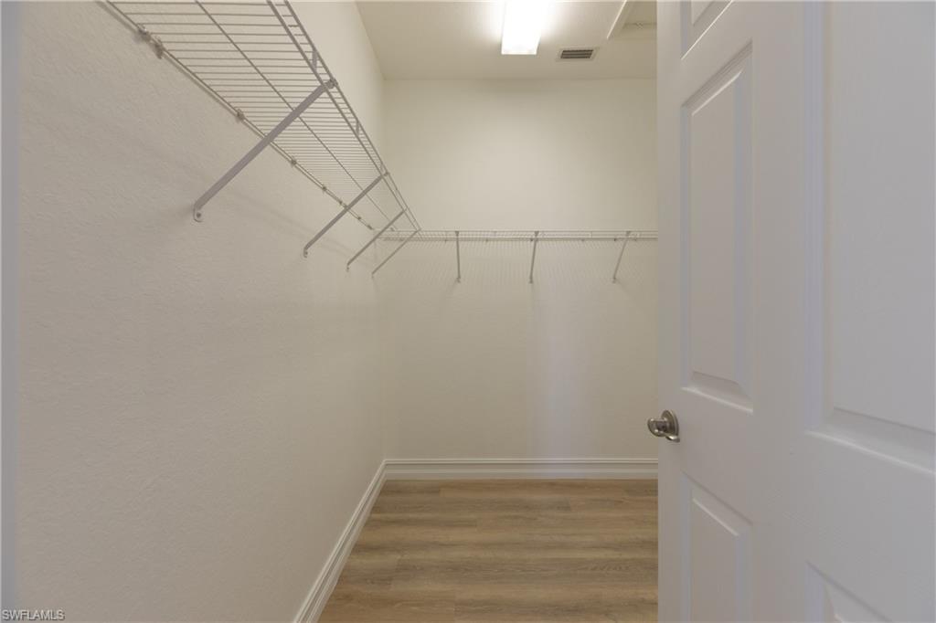 15618 Summit Pl Circle, Unit 396 Naples, FL 34119 - Photo 16 of 41 a view of small space with racks on the wall