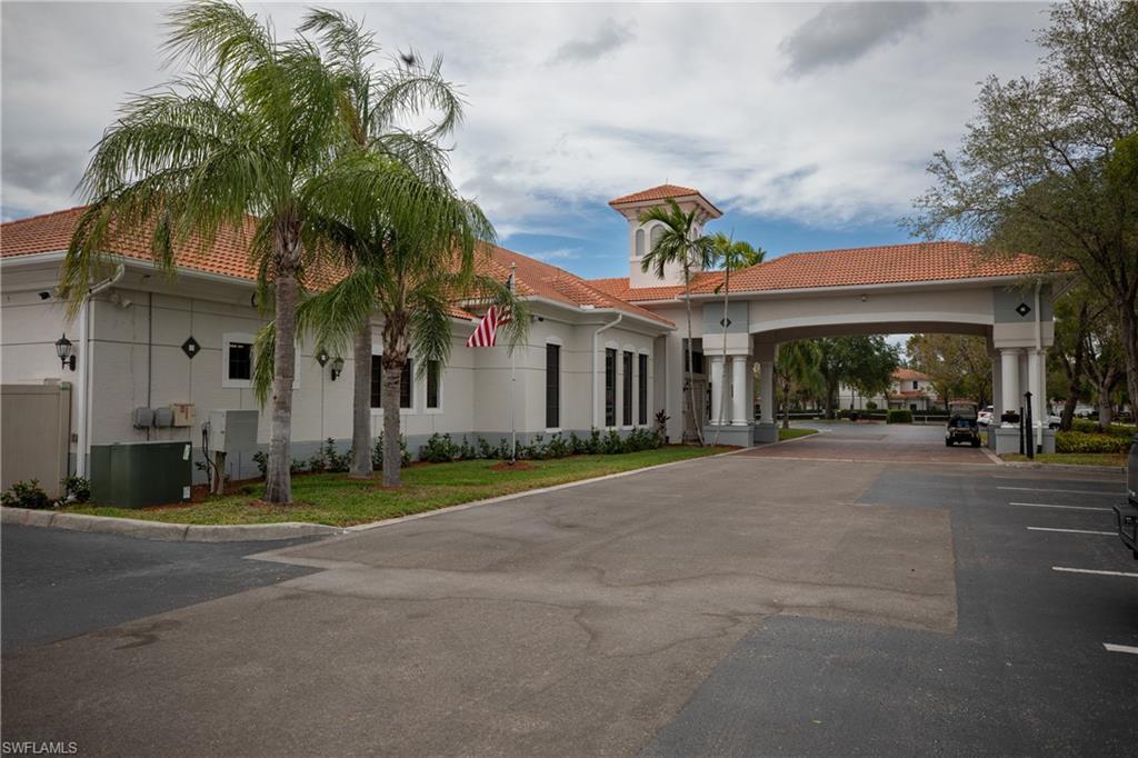 15618 Summit Pl Circle, Unit 396 Naples, FL 34119 - Photo 34 of 41 a front view of house with yard and green space