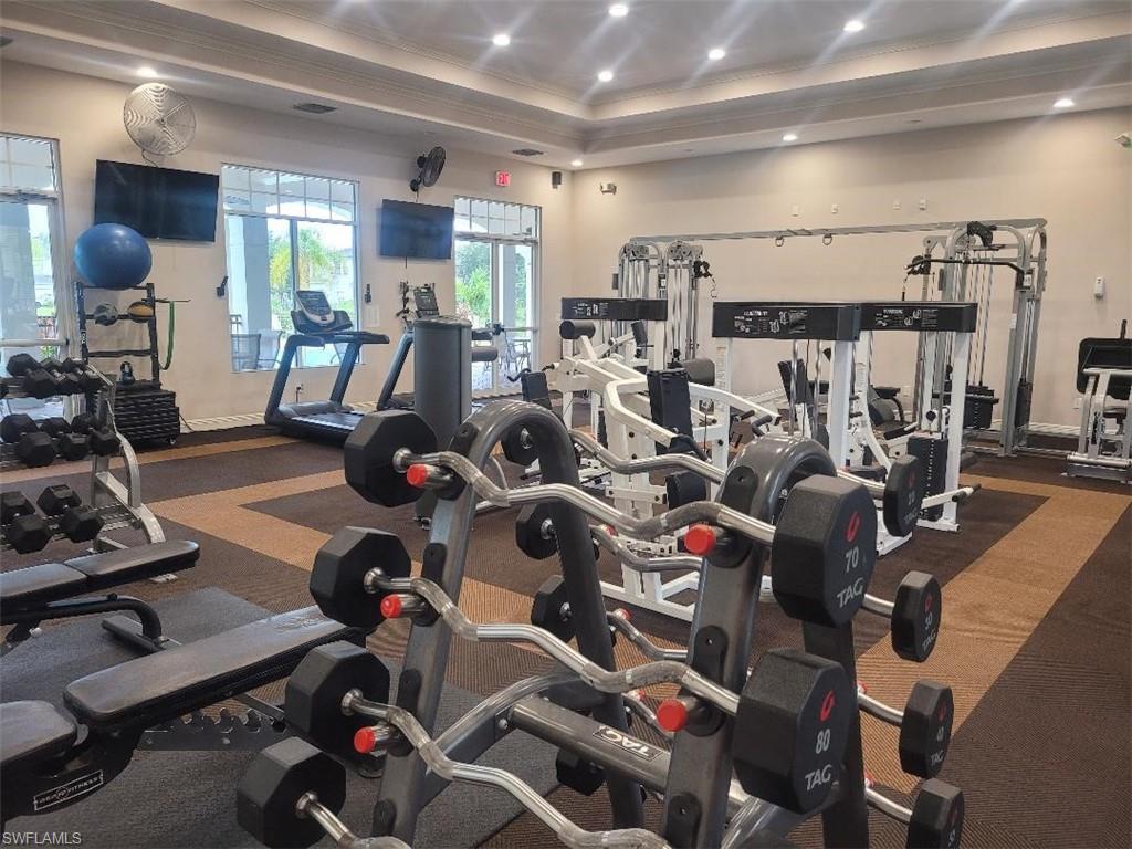 15618 Summit Pl Circle, Unit 396 Naples, FL 34119 - Photo 38 of 41 a view of a room with gym equipment