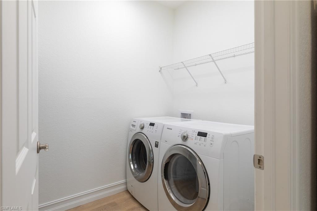 15618 Summit Pl Circle, Unit 396 Naples, FL 34119 - Photo 10 of 41 a utility room with dryer and washer
