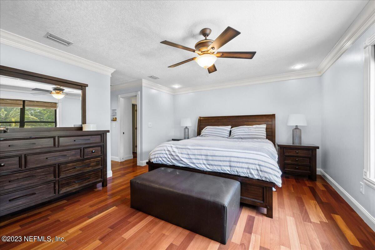 174 Eventide Drive Fleming Island, FL 32003 - Photo 13 of 24 a bedroom with a bed and a dresser