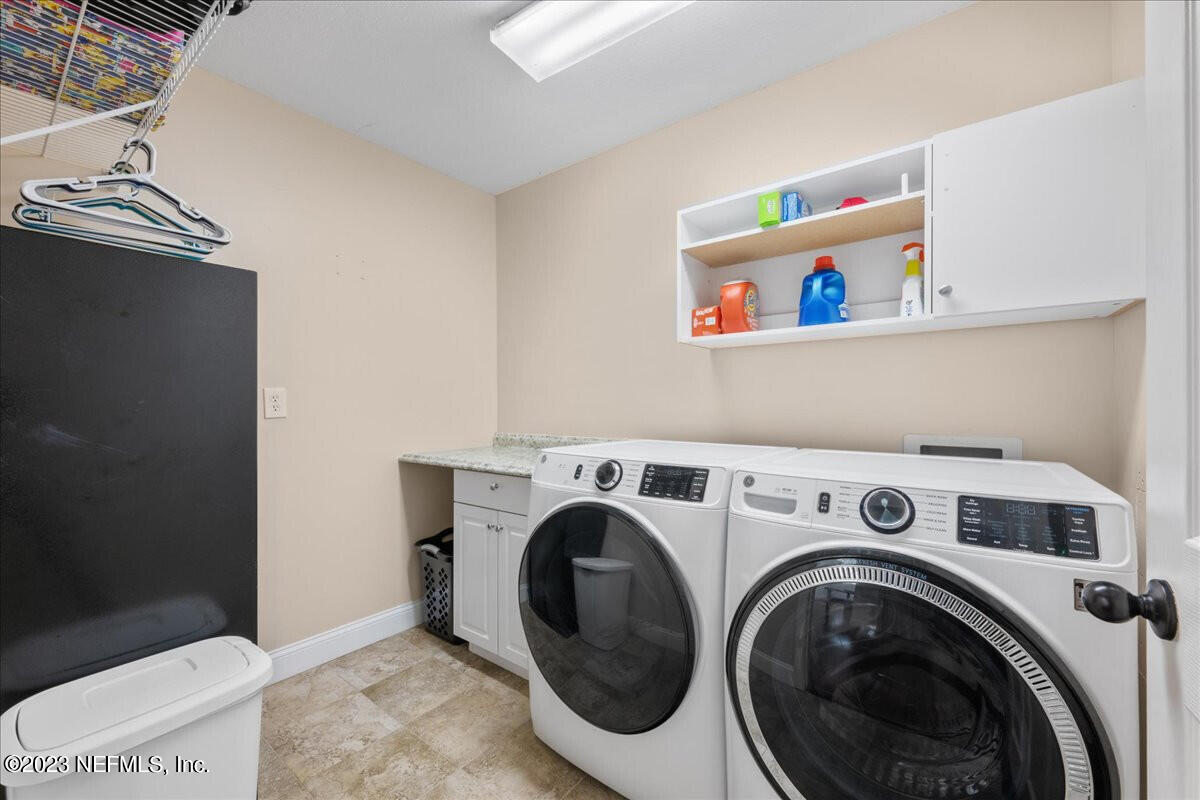 174 Eventide Drive Fleming Island, FL 32003 - Photo 17 of 24 a utility room with dryer and washer