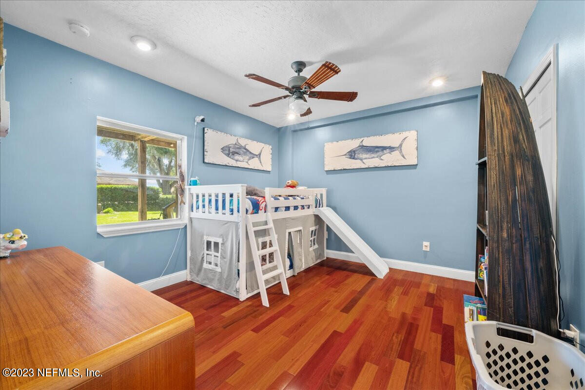 174 Eventide Drive Fleming Island, FL 32003 - Photo 19 of 24 a bedroom with a bed and a window