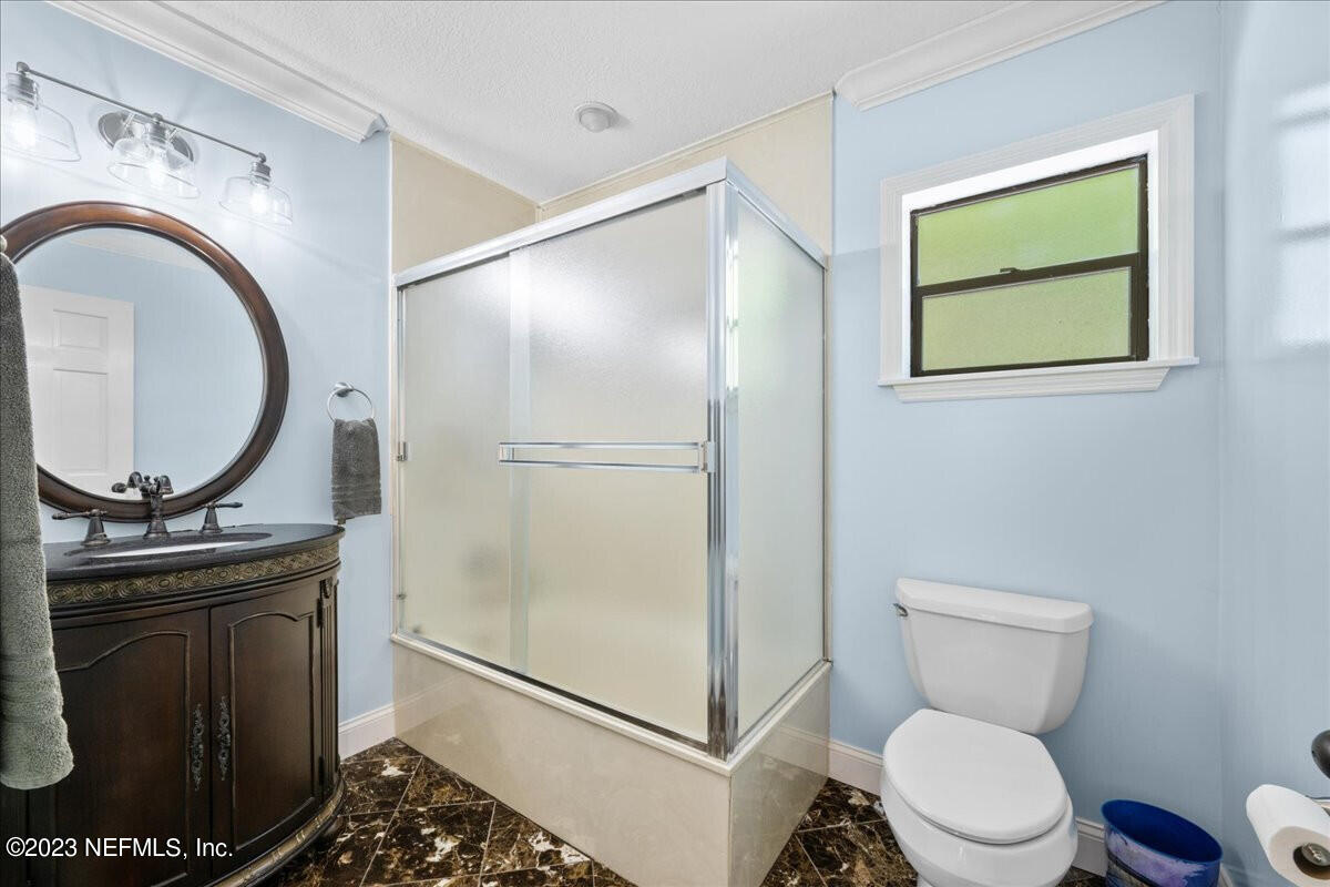 174 Eventide Drive Fleming Island, FL 32003 - Photo 22 of 24 a bathroom with a toilet and a sink