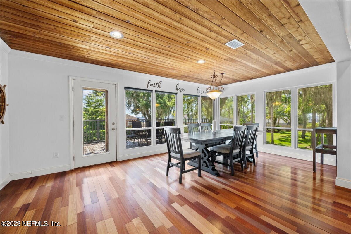 174 Eventide Drive Fleming Island, FL 32003 - Photo 8 of 24 a dining room with furniture window and wooden floor