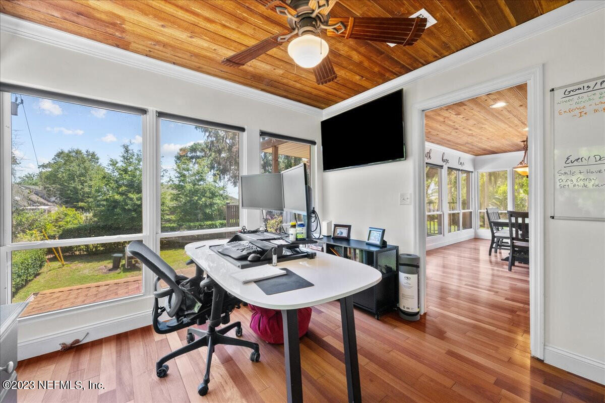 174 Eventide Drive Fleming Island, FL 32003 - Photo 10 of 24 a view of a dining room with furniture window and wooden floor