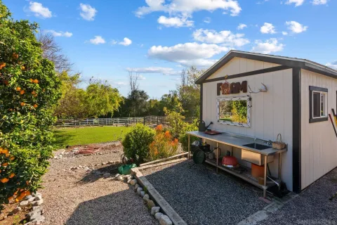 a view of back yard of a house