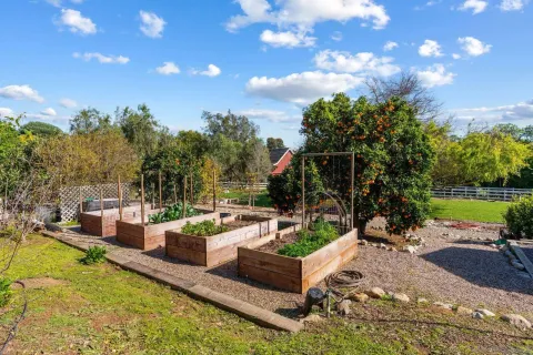 a view of a swimming pool with a patio and a yard