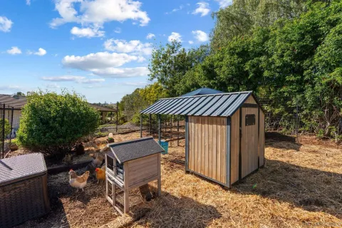 a view of a backyard with sitting area