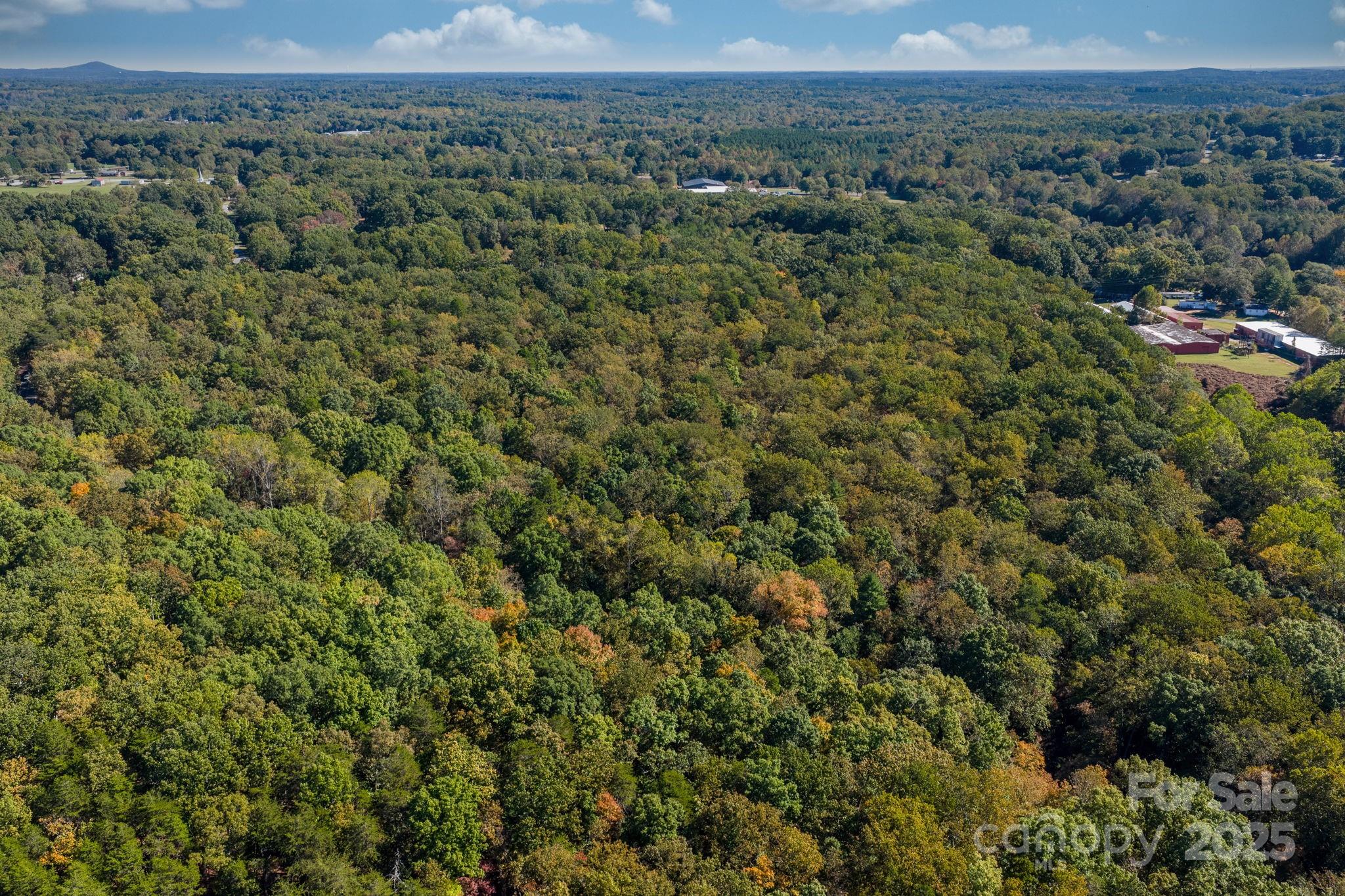 Tbd Southfork Road Lincolnton, NC 28092 - Photo 36 of 38 an aerial view of a houses with a lush green hillside