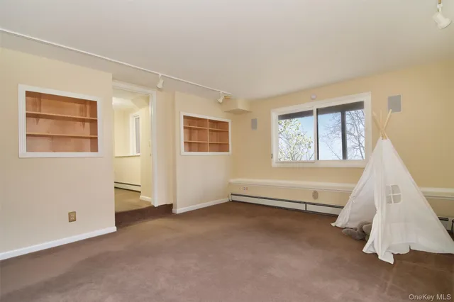 a room with gym equipment and a window