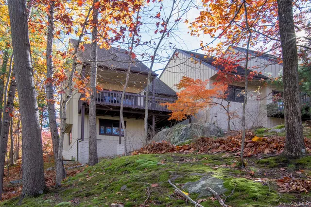 a view of a house with a tree
