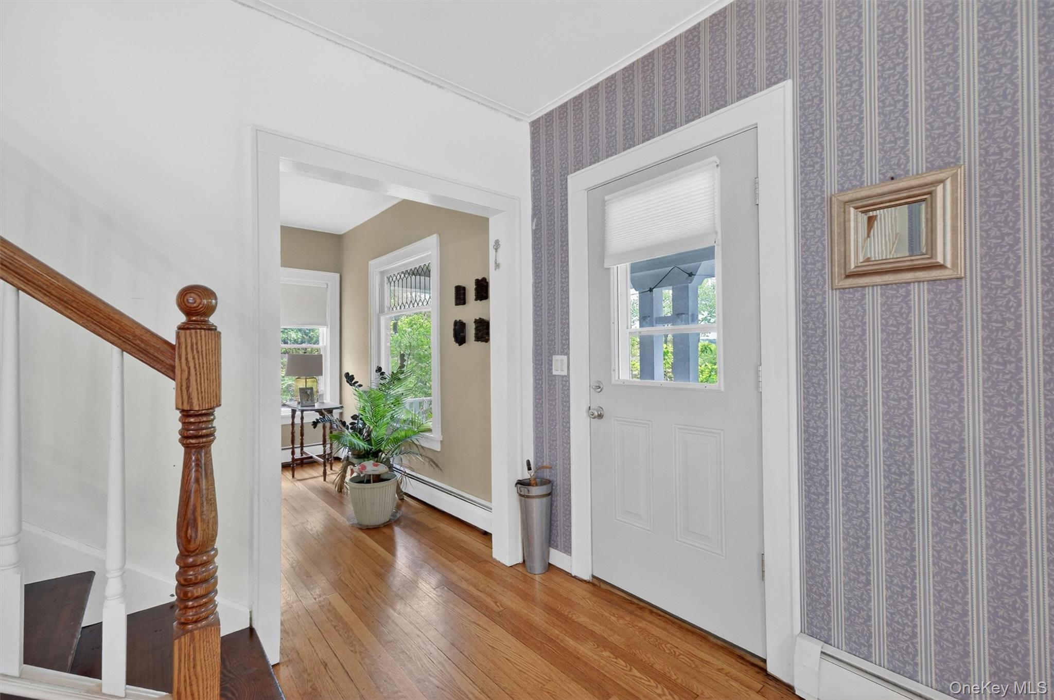 10 Edwin Road Poughkeepsie, NY 12603 - Photo 6 of 46 a view of a hallway with wooden floor and a dining room