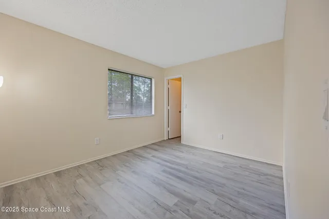a kitchen with stainless steel appliances a refrigerator and a stove top oven