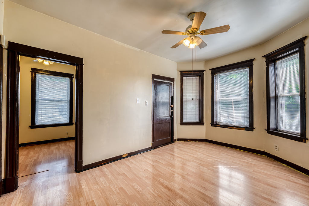 1738 North Harding Avenue Chicago, IL 60647 - Photo 16 of 21 a view of an empty room with a window and wooden floor