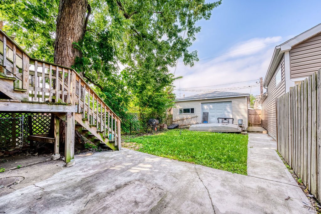 1738 North Harding Avenue Chicago, IL 60647 - Photo 21 of 21 a view of a house with a yard and deck