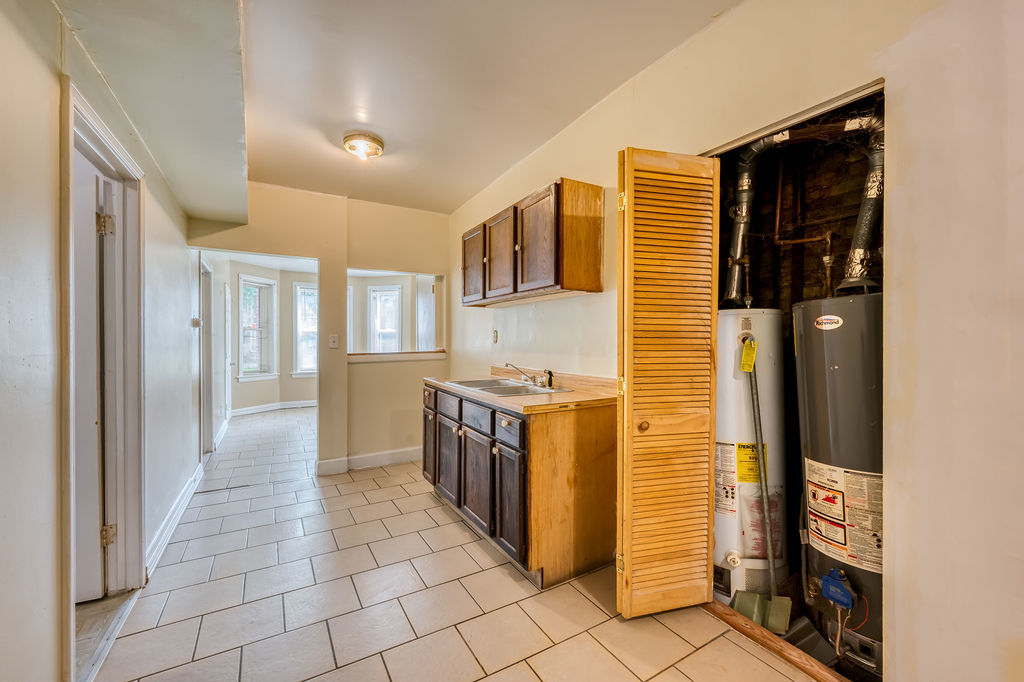 1738 North Harding Avenue Chicago, IL 60647 - Photo 9 of 21 a kitchen with stainless steel appliances granite countertop a refrigerator and a stove