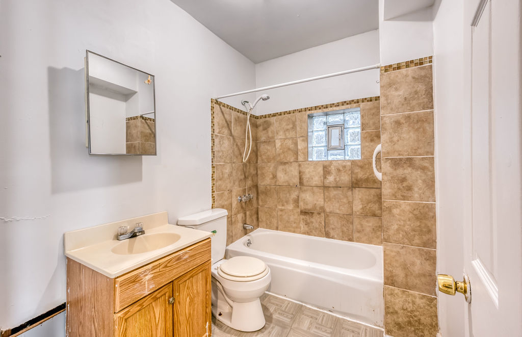 1738 North Harding Avenue Chicago, IL 60647 - Photo 10 of 21 a bathroom with a sink toilet and shower