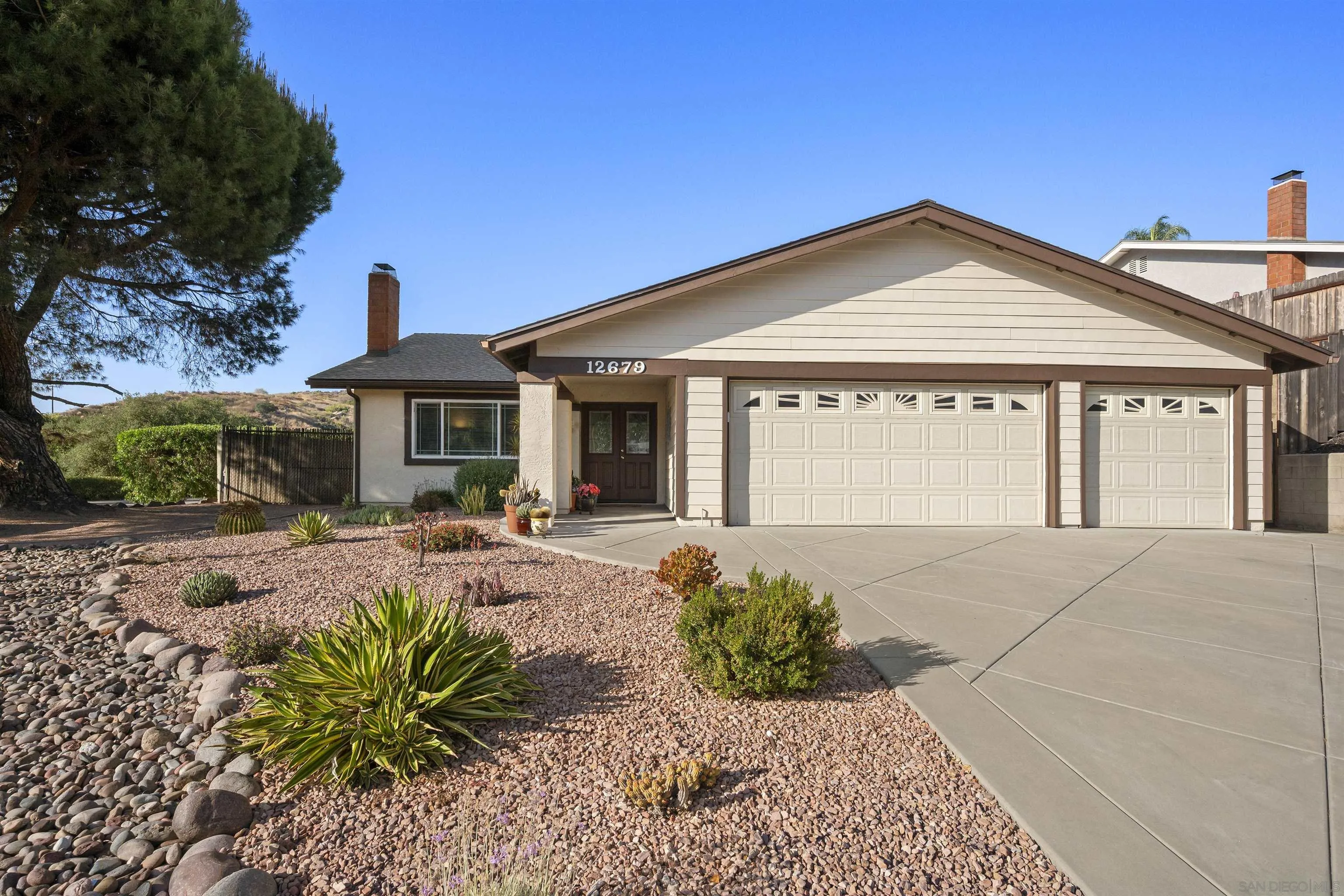12679 Ridgeton Drive Lakeside, CA 92040 - Photo 4 of 33 a front view of a house with a yard