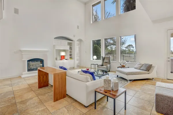a living room with furniture and next to a window