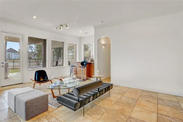 a living room with furniture and a rug