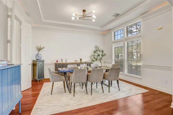 a living room with fireplace furniture and a floor to ceiling window