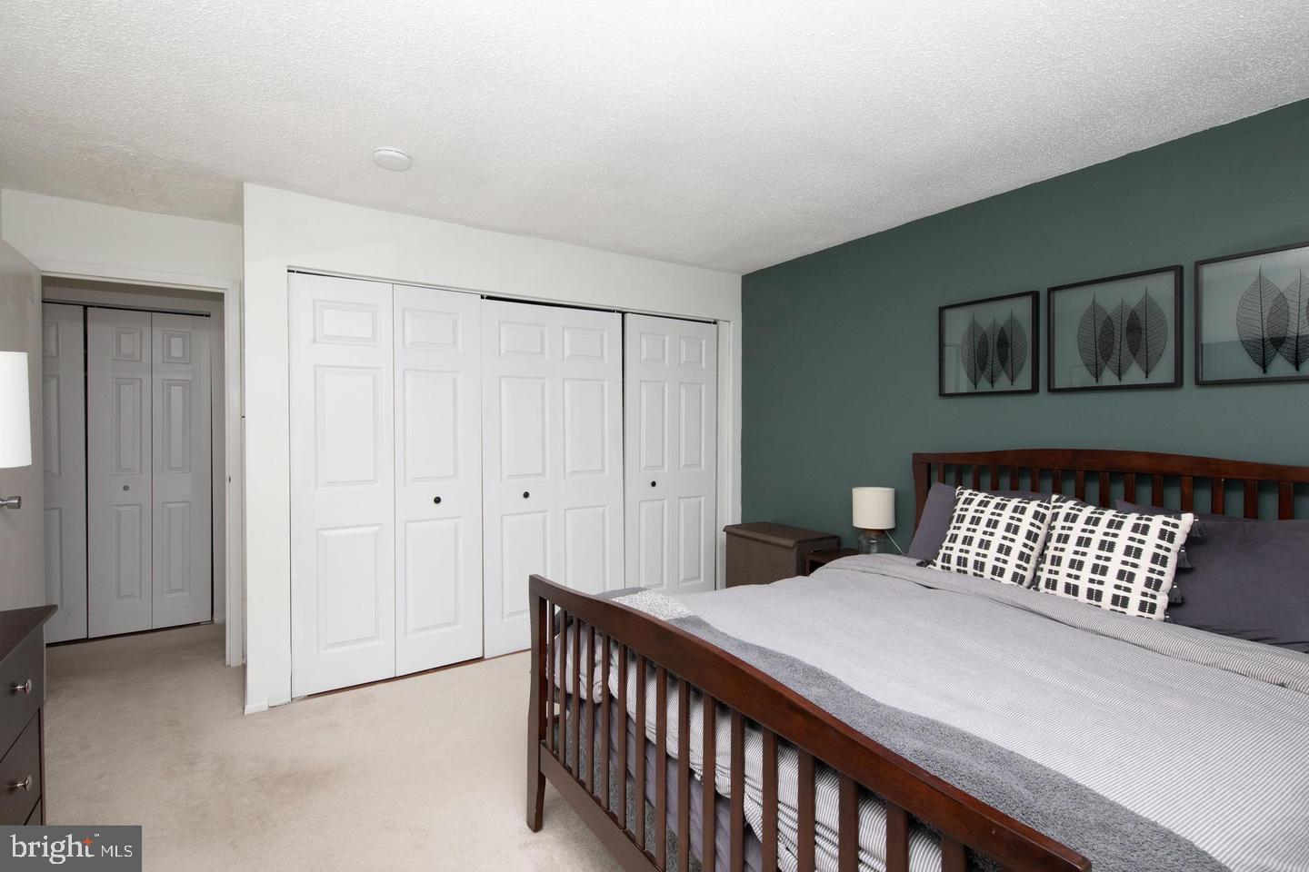 250 Ridge Pike, Unit 346B Lafayette Hill, PA 19444 - Photo 15 of 27 a bedroom with a bed and wooden floor