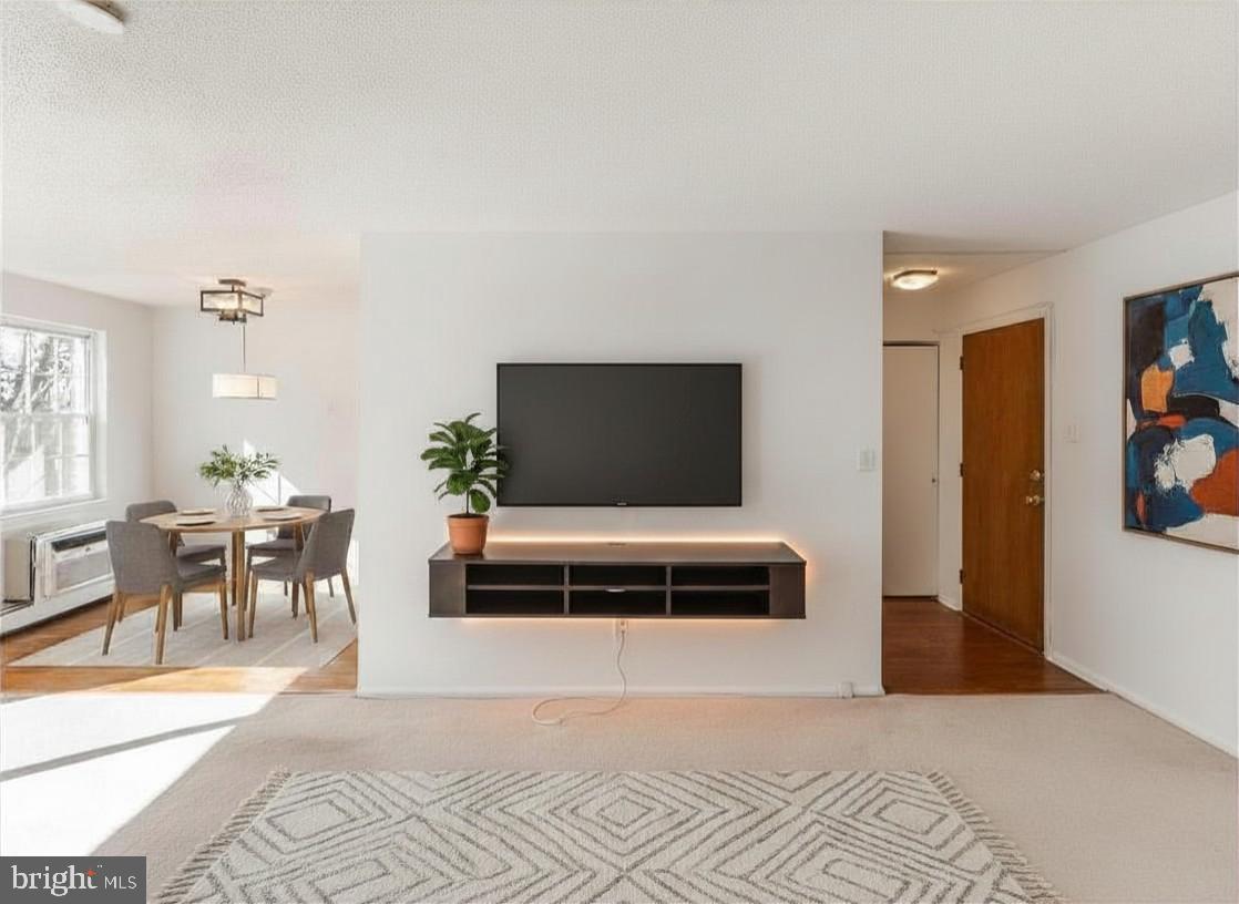 250 Ridge Pike, Unit 346B Lafayette Hill, PA 19444 - Photo 2 of 27 a living room with furniture and a flat screen tv