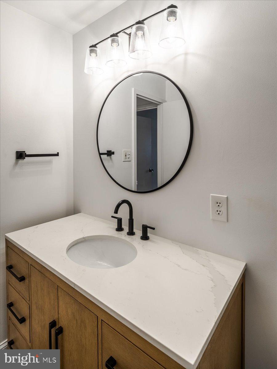 250 Ridge Pike, Unit 346B Lafayette Hill, PA 19444 - Photo 21 of 27 a bathroom with a sink and a mirror
