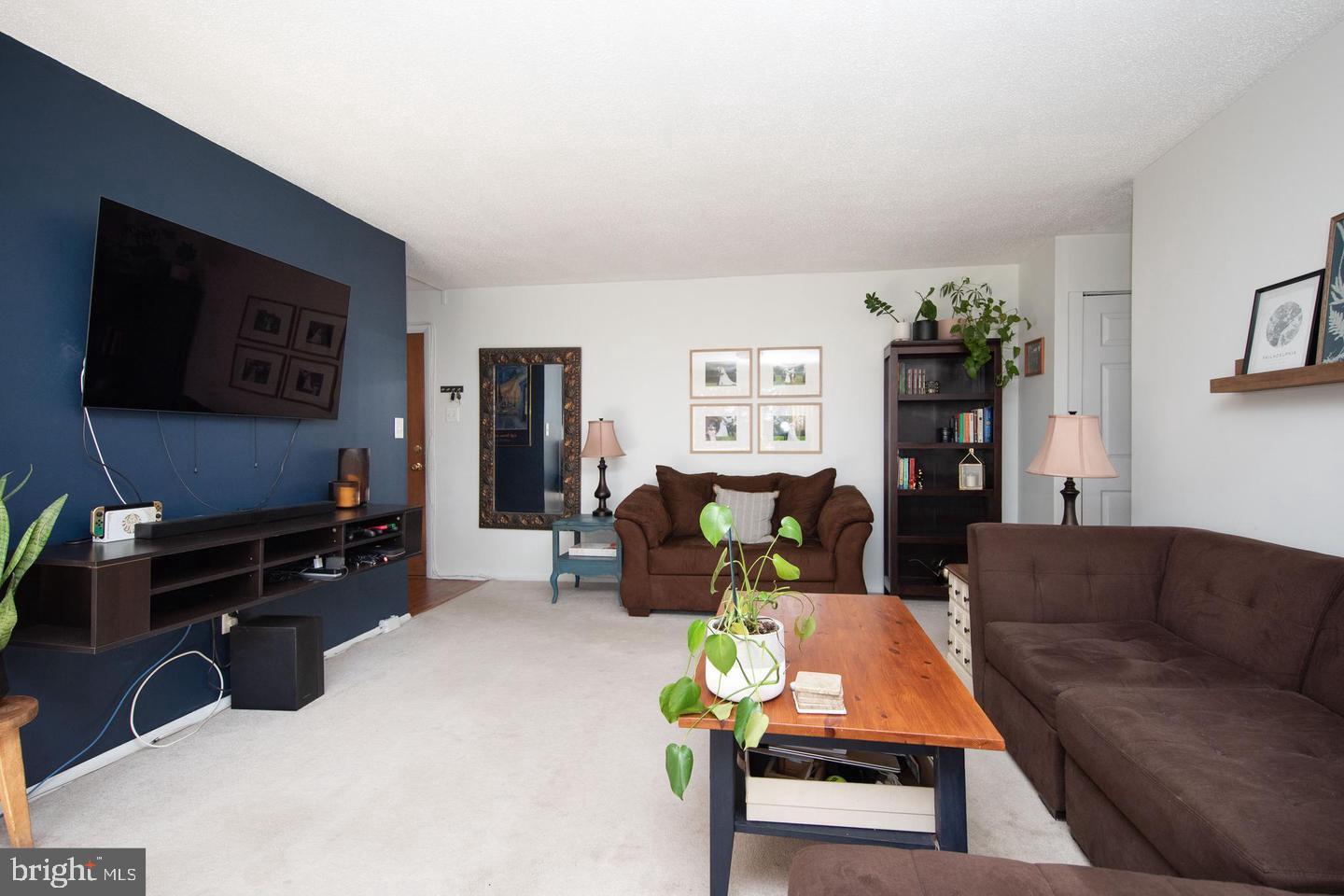 250 Ridge Pike, Unit 346B Lafayette Hill, PA 19444 - Photo 10 of 27 a living room with furniture and a flat screen tv