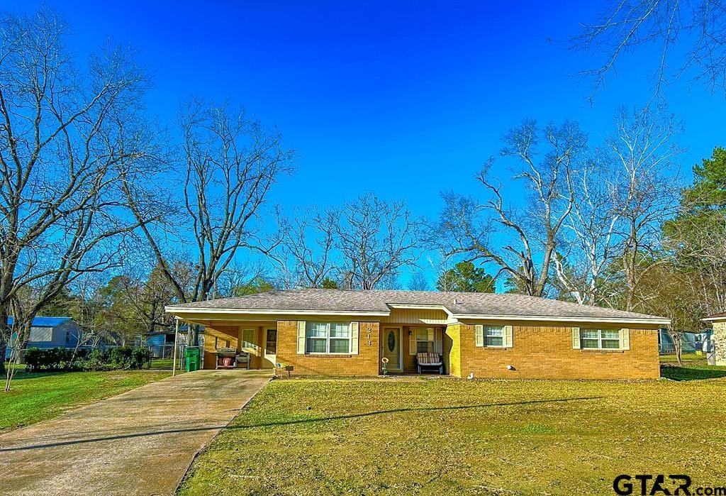 front view of a house with a big yard