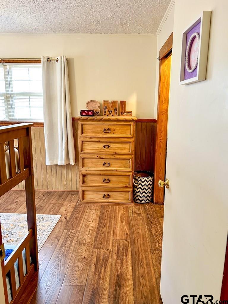 213 Sherry Lane Palestine, TX 75803 - Photo 20 of 25 a view of a bedroom with wooden floor and windows