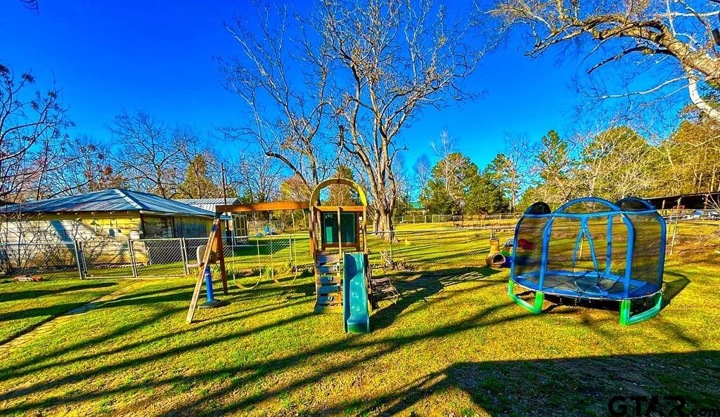 213 Sherry Lane Palestine, TX 75803 - Photo 24 of 25 a view of a yard with swimming pool