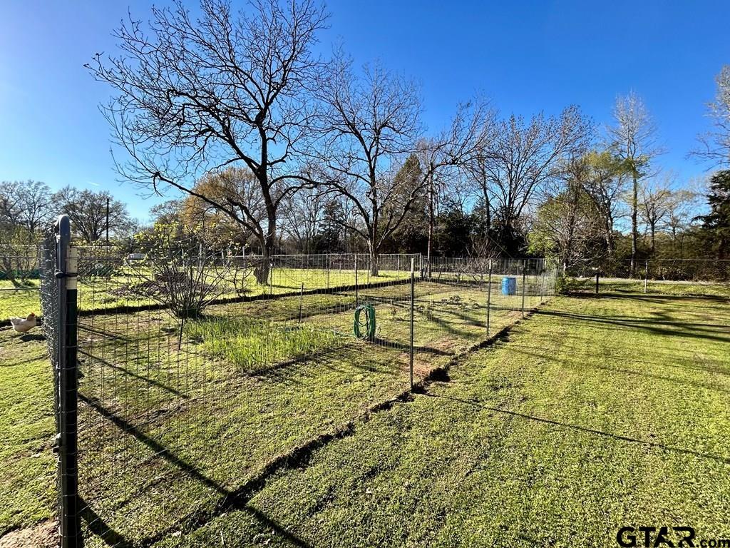 213 Sherry Lane Palestine, TX 75803 - Photo 25 of 25 a view of swimming pool with seating area and trees around