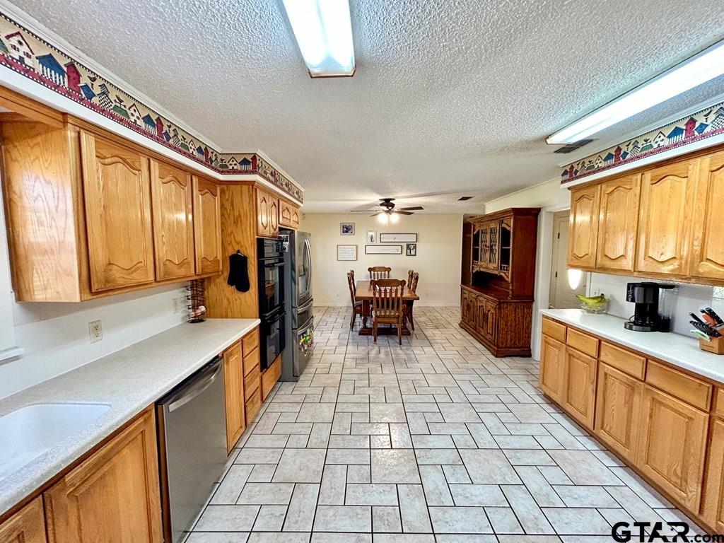 213 Sherry Lane Palestine, TX 75803 - Photo 9 of 25 a large white kitchen with a large window