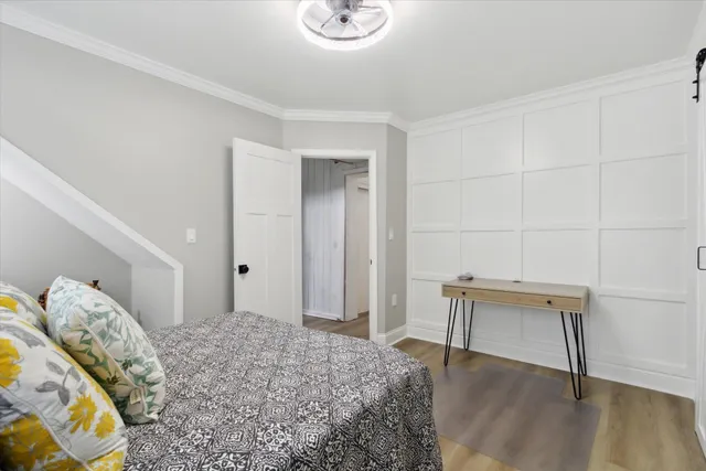 a bedroom with a bed and a table in it