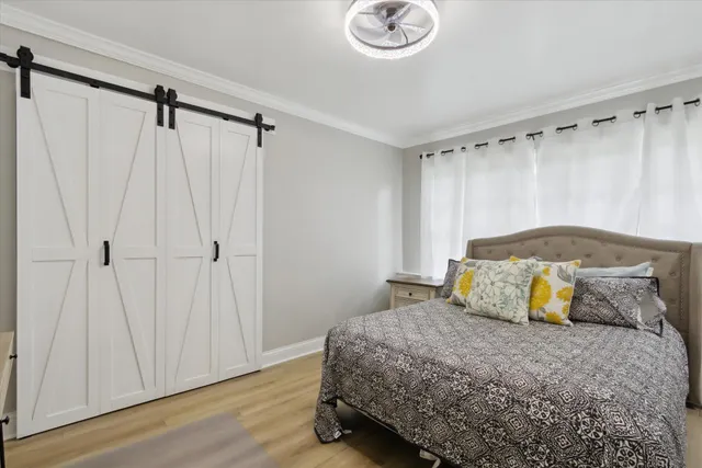 a bedroom with a bed and a mirror