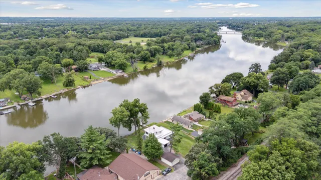 an aerial view of a houses with outdoor space