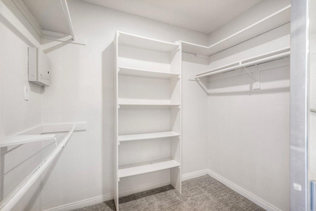 3375 Genoa Way, Unit 144 Oceanside, CA 92056 - Photo 21 of 34 Nice organizers in this primary walk in closet