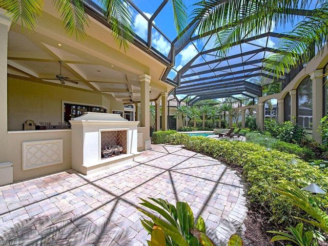 a living room with couch and a dining table