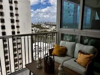a view of a living room with furniture and a window