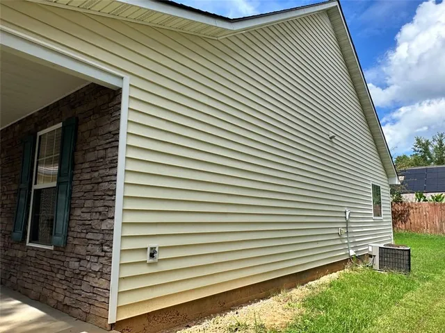a view of a house with a large window