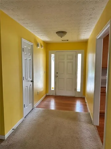a view of a hallway with a yellow space