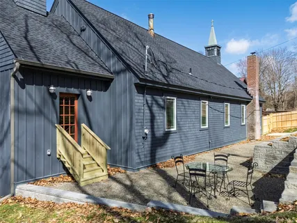 a view of a house with wooden deck