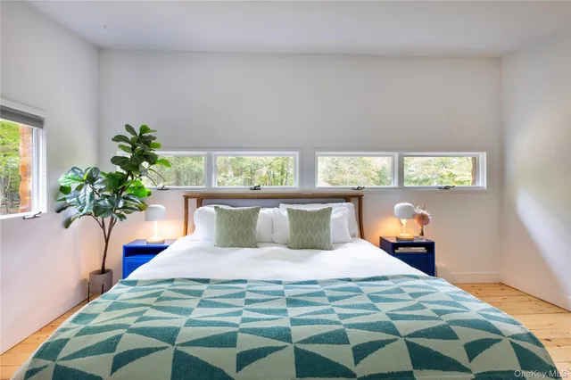 a bathroom with a tub shower and sink